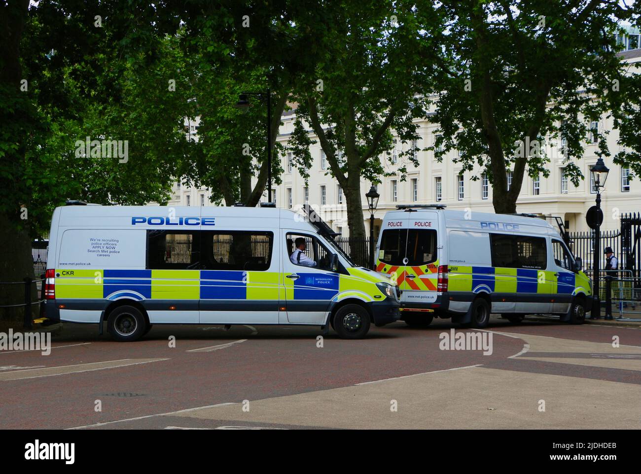 Police vans blocking closed Birdcage Walk near Buckingham Palace while