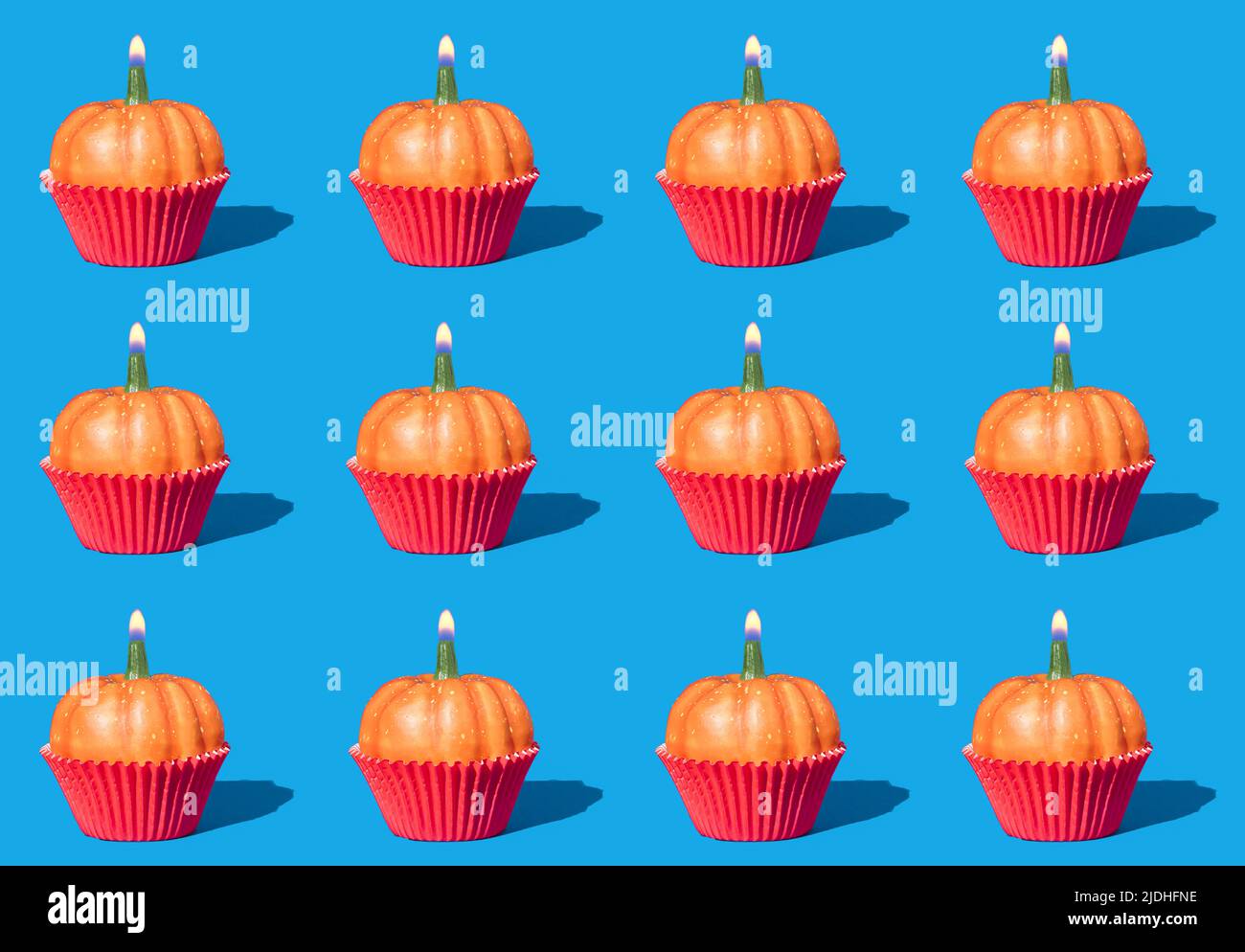 Autumn pattern with pumpkins and birthday candles. Creative holiday party background. Halloween minimal backdrop. Stock Photo