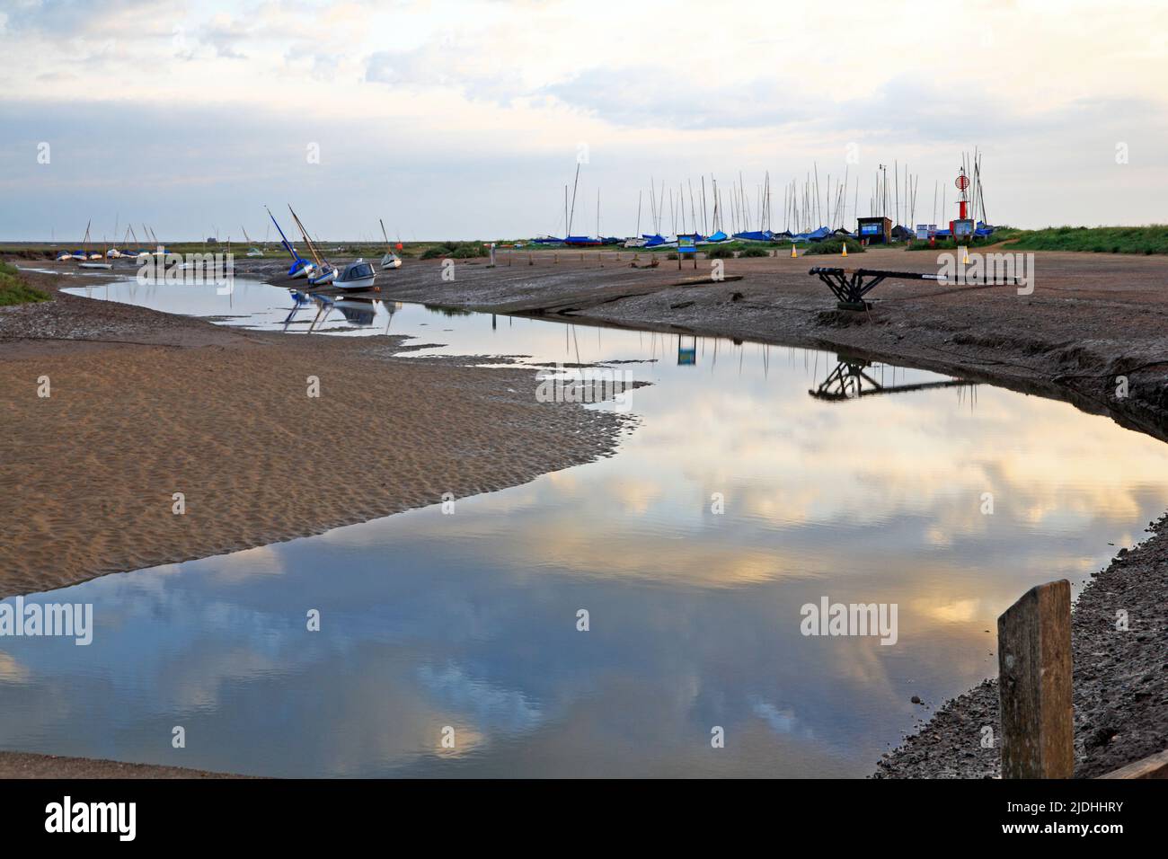A view of Blakeney Channel approaching low water from the harbour quayside in North Norfolk at Blakeney, Norfolk, England, United Kingdom. Stock Photo