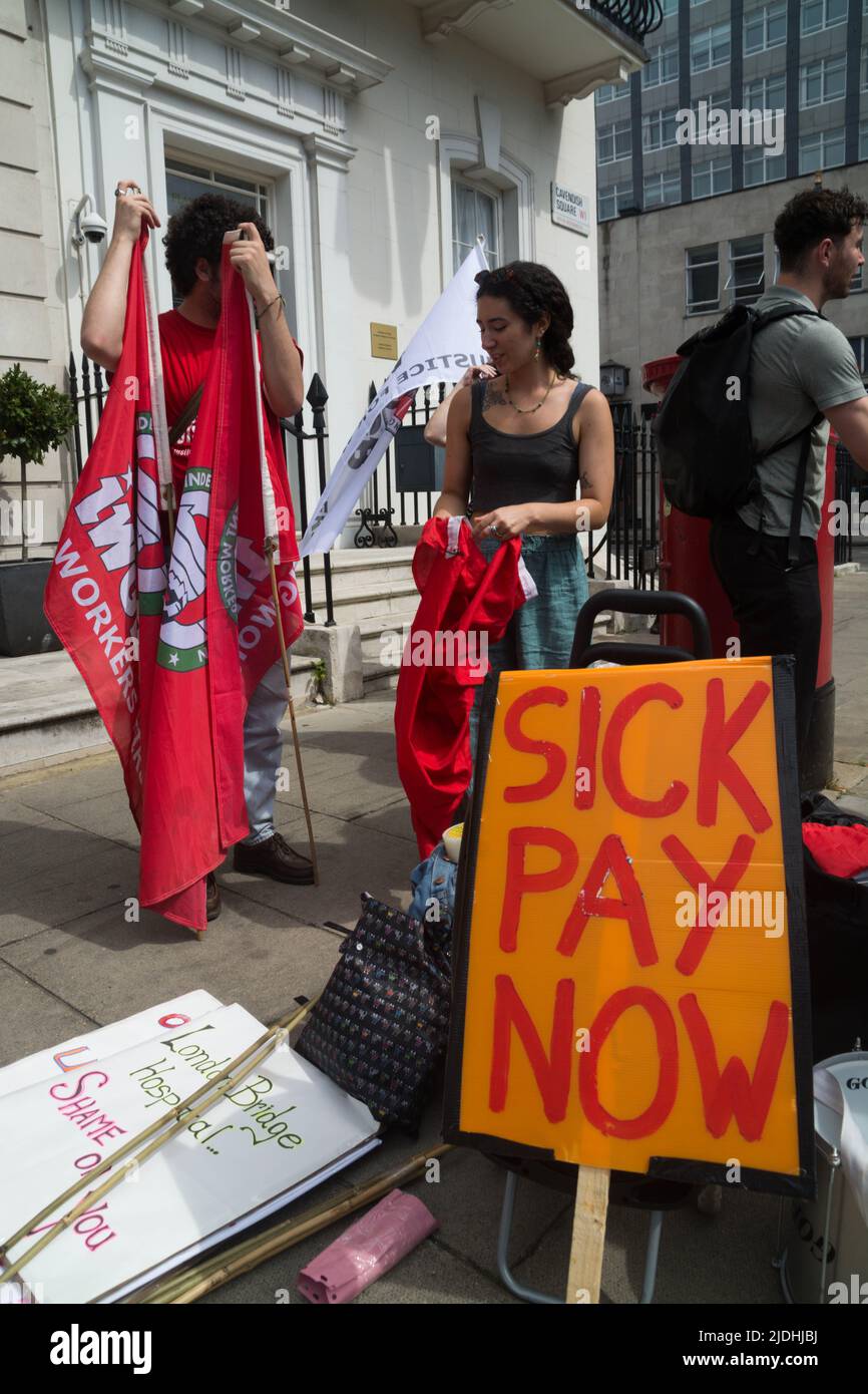workers and hospital cleaners picket london hq of HCA  over poor treatment and pay conditions in the health sector for outsourced services. Stock Photo