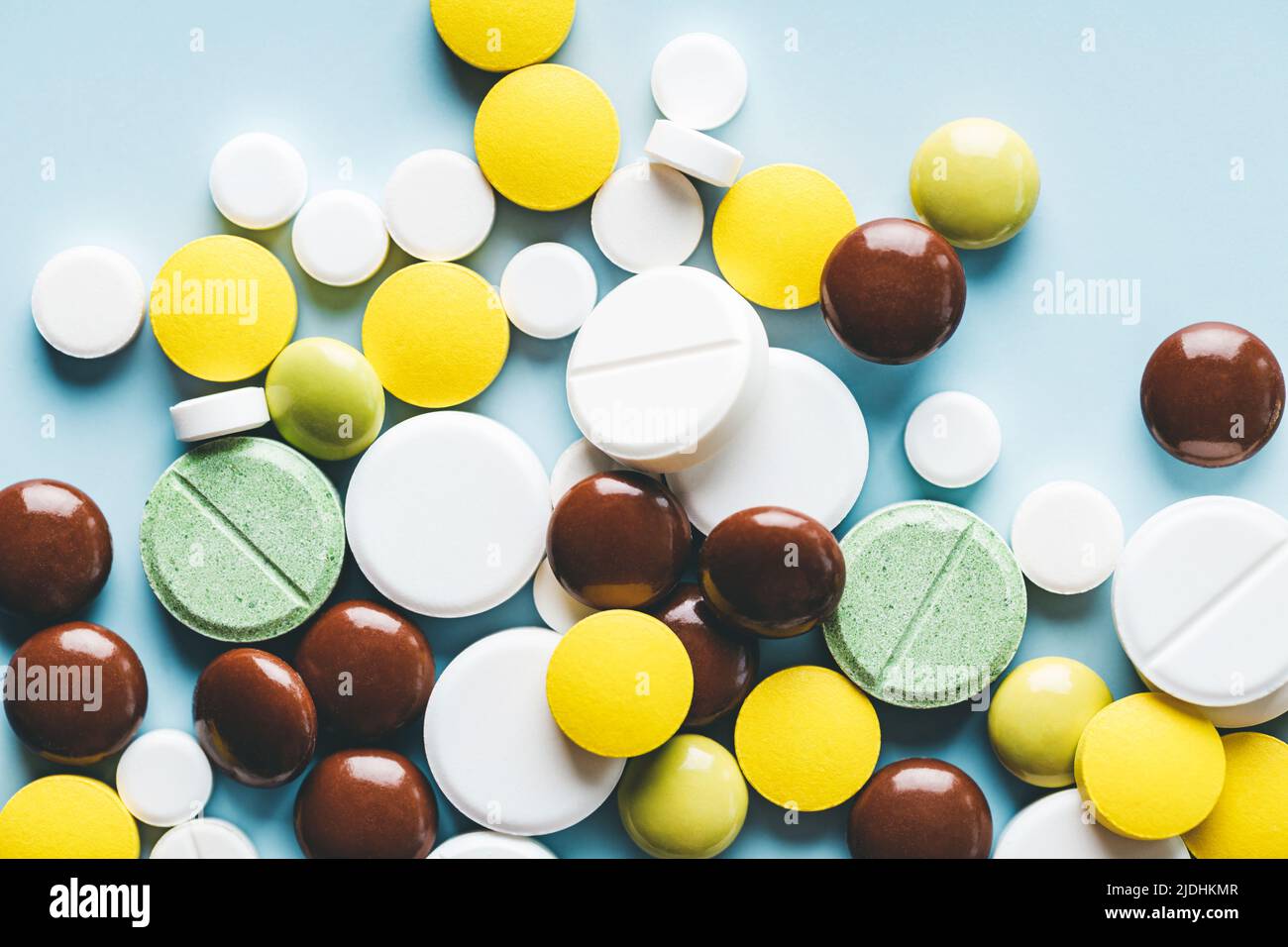 Close up of various pills on blue background. Stock Photo