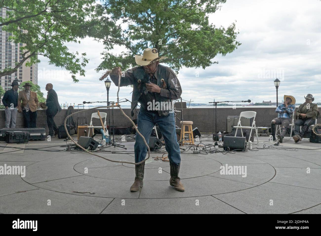 A Juneteenth celebration in Battery Park City included rope skills demonstrated by Rawly 'Curly' Hall, a member of the Federation of Black Cowboys. Stock Photo