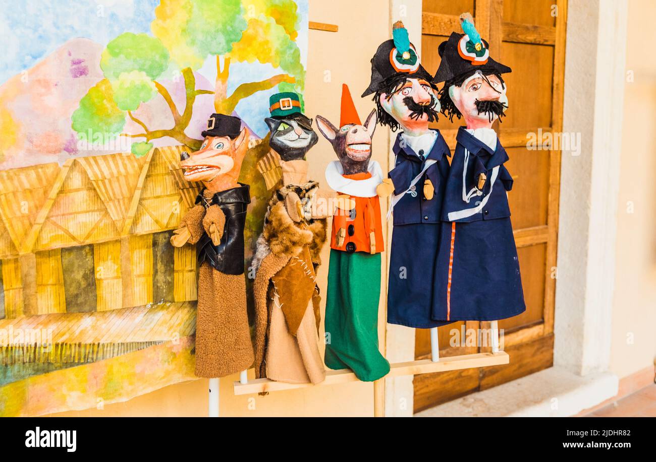 Colorful handmade Italian-style puppets in a children's theater performance. Stock Photo