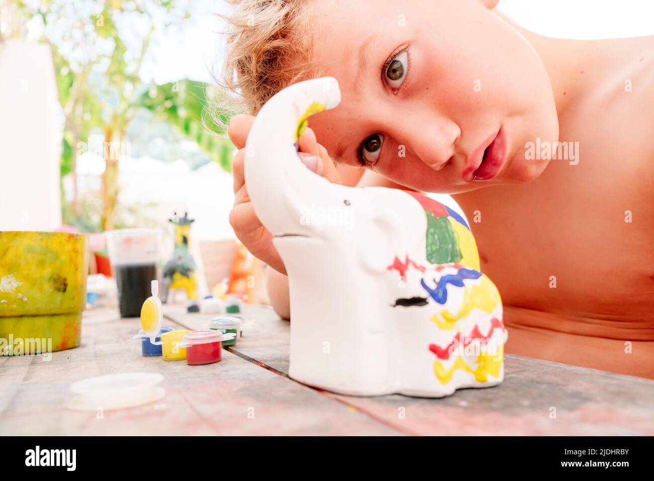 In summer the children's creative activities help to entertain themselves by developing artistic creativity. Stock Photo