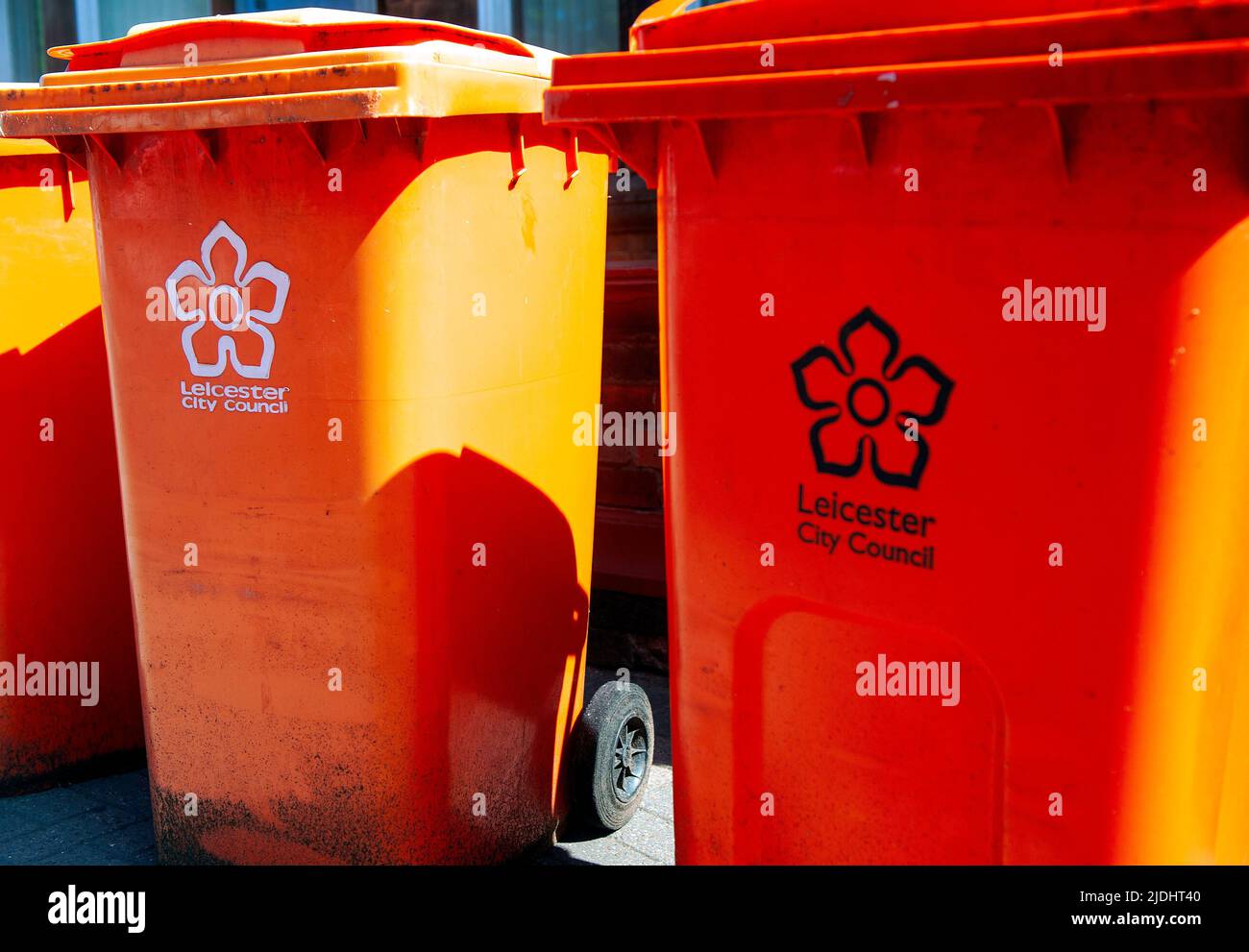 Orange commercial wheelie bins Stock Photo Alamy