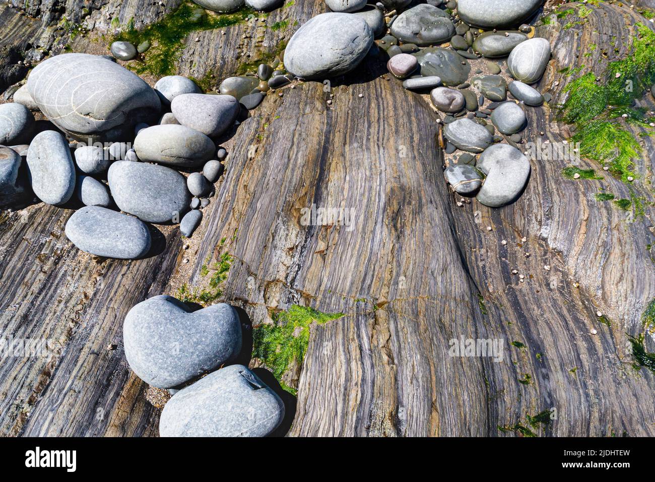 Exposed rocks showing coastal erosion hi-res stock photography and ...