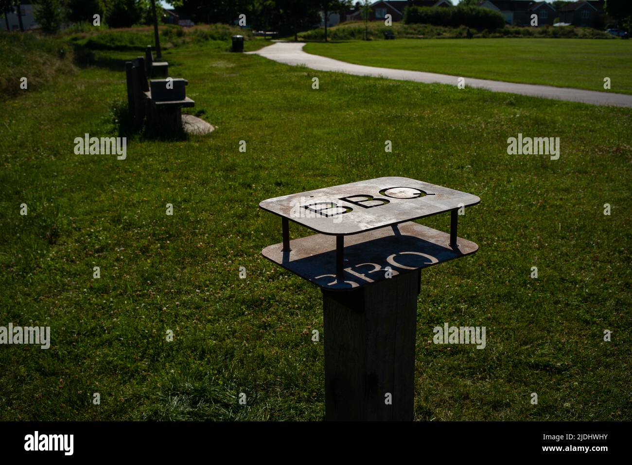 Metal barbecue safety stand for disposable barbecues in public park in Eastleigh near Southampton Hampshire England to prevent fires and accidents. Stock Photo