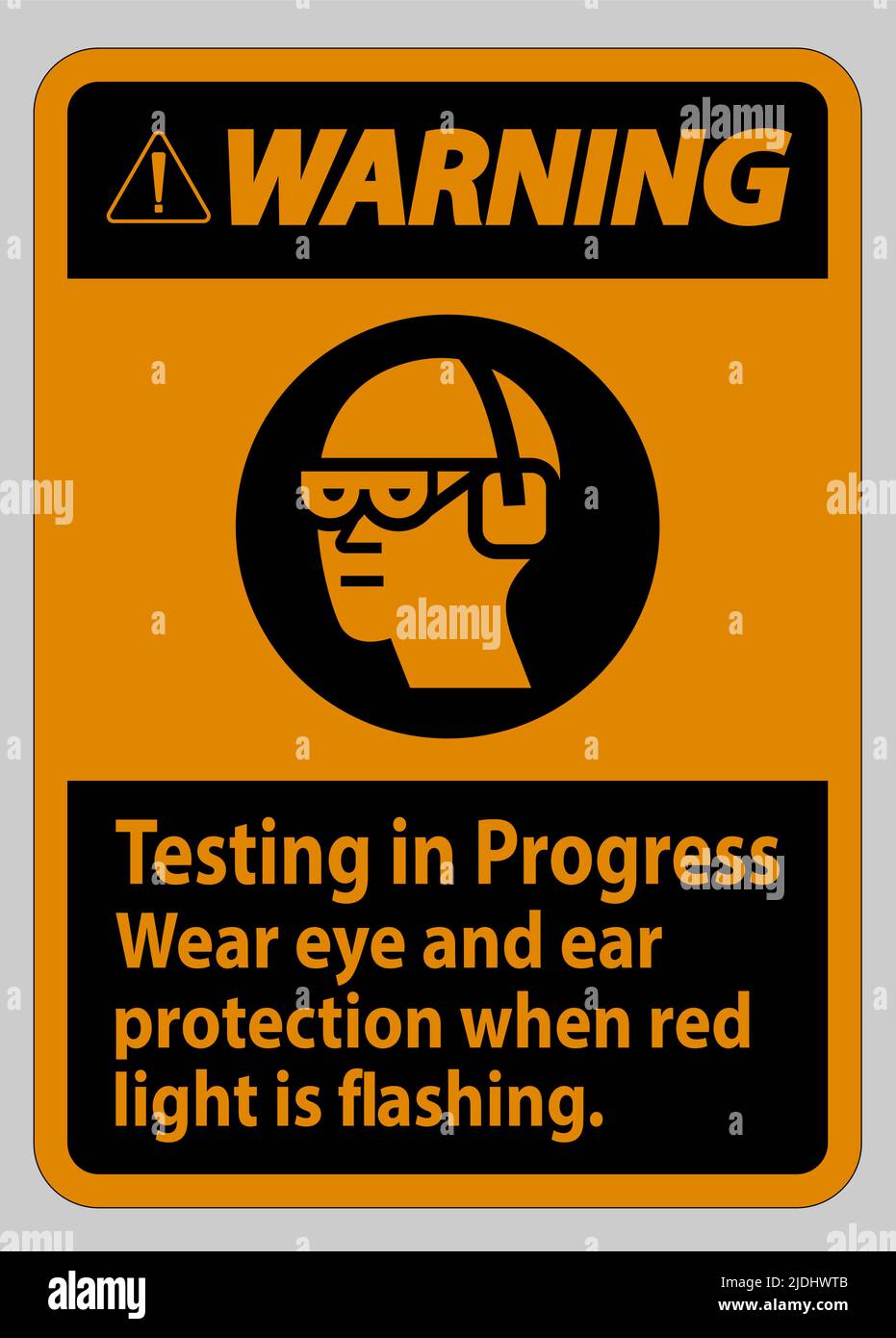 Warning Sign Testing In Progress, Wear Eye And Ear Protection When Red Light Is Flashing Stock