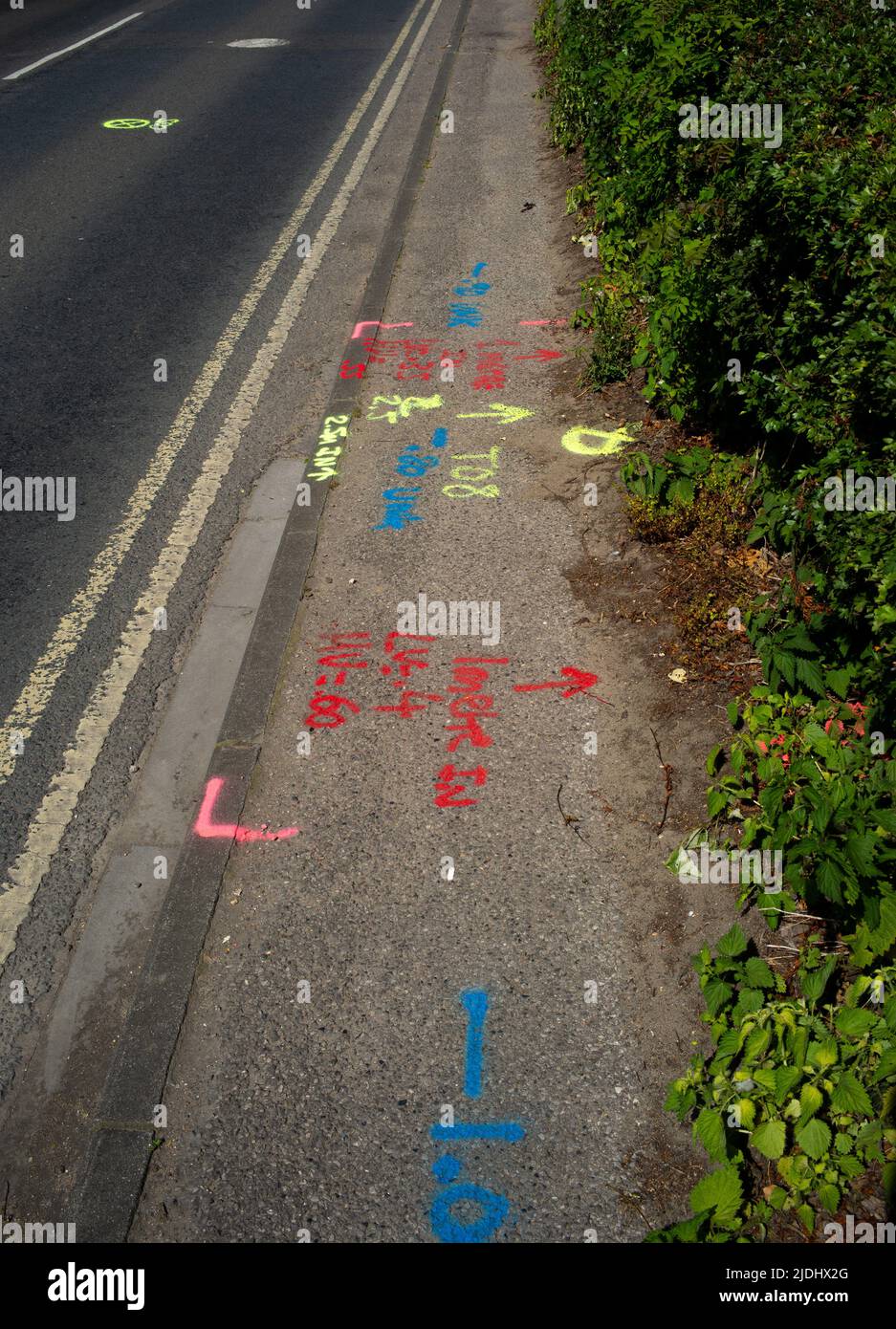 Colourful pavement spray paint markings for utility cables