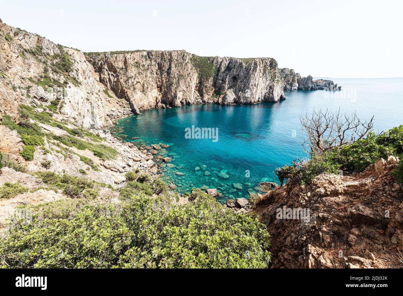 View from the cliff edge to the Mediterranean Sea and the bay of Sciusciau near Cala Domestica in the southwest of Sardinia, Iglesiente,Italy Stock Photo