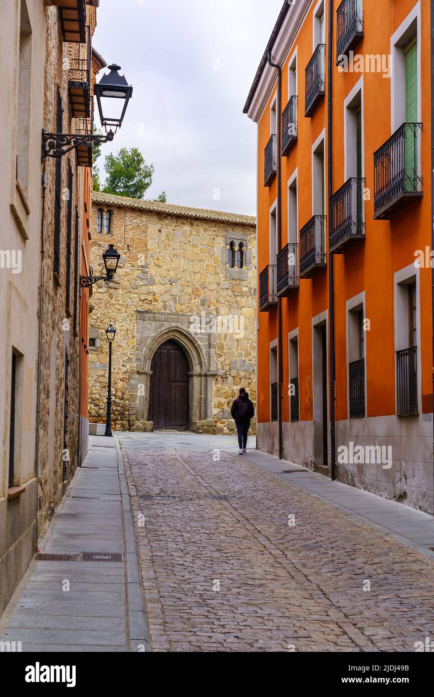 Alley with old houses with typical balconies in the medieval city of