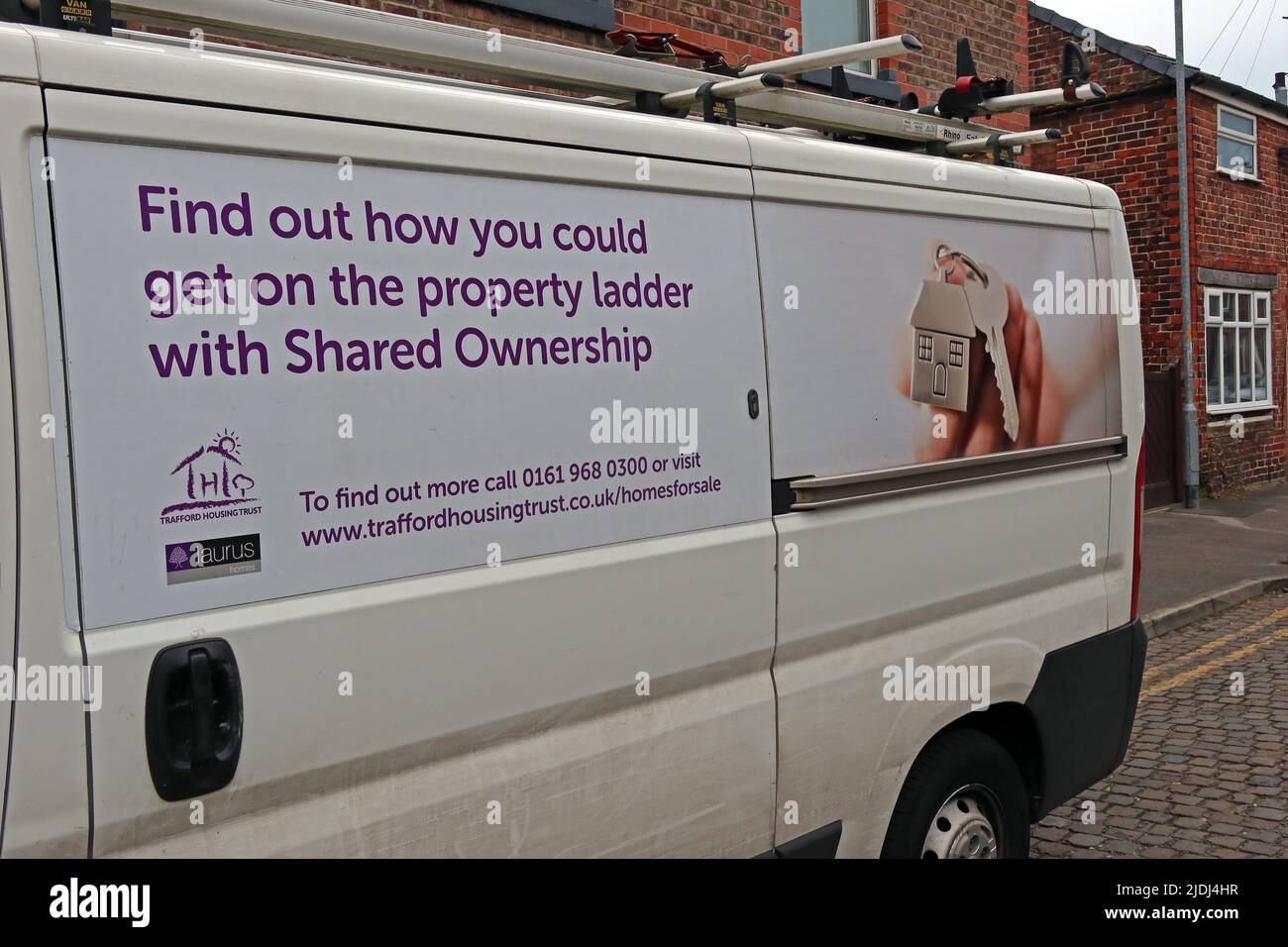 Trafford Housing Trust repair operative van, advertising Shared Ownership, Point, 126-150 Washway Rd, Sale, Manchester, UK, M33 6AG Stock Photo