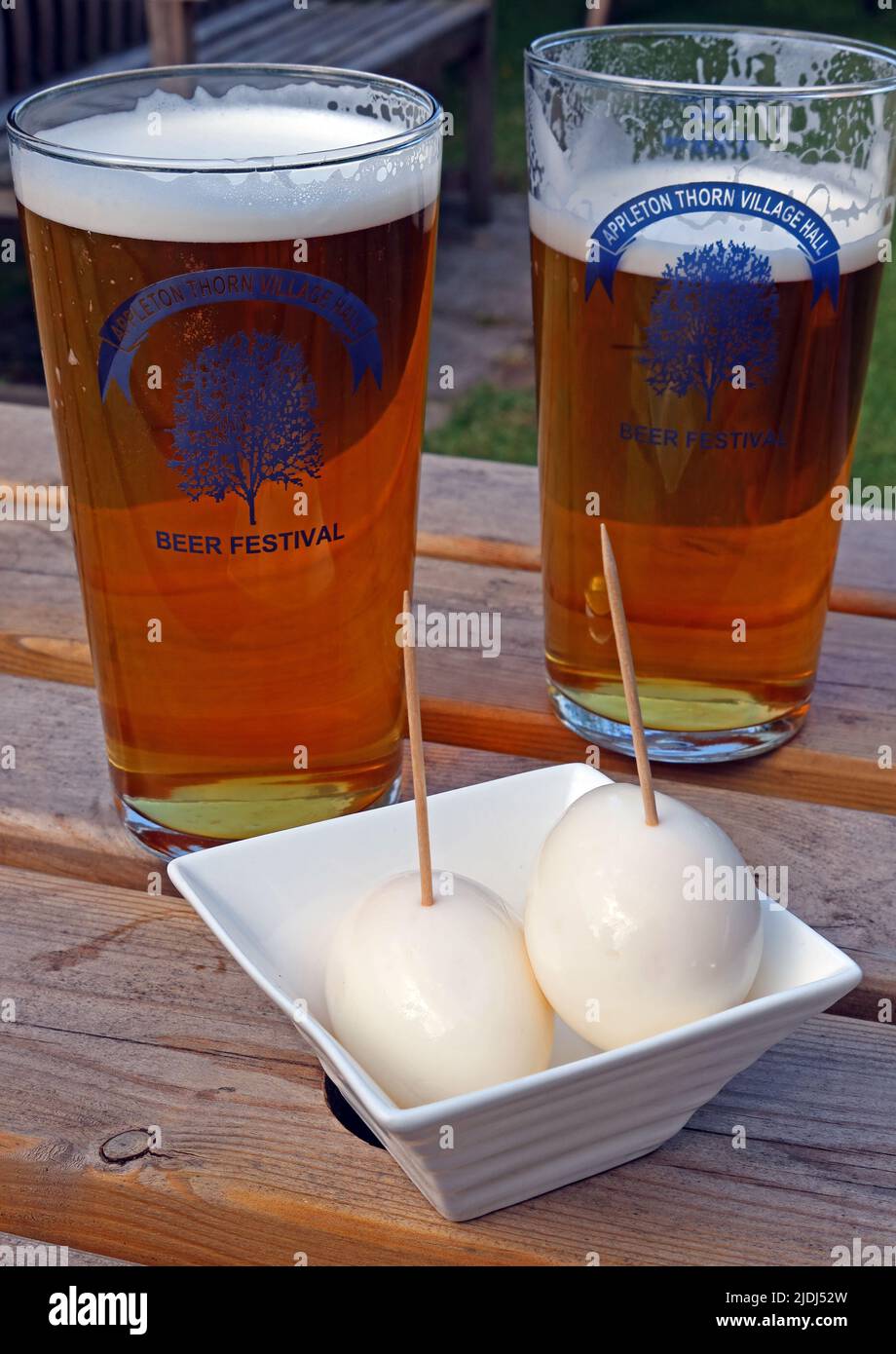 Two pints of beer and a couple of pickled eggs, marinated in vinegar, Appleton Thorn Village Hall, Warrington, Cheshire, England, UK, WA4 4RT Stock Photo