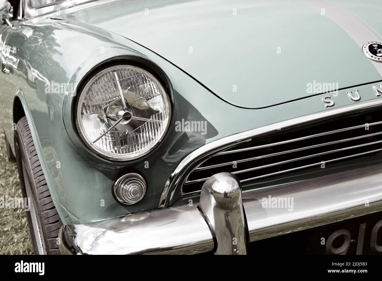 Close up front headlight detail of a classic vintage Sunbeam Rapier motor car. Stock Photo