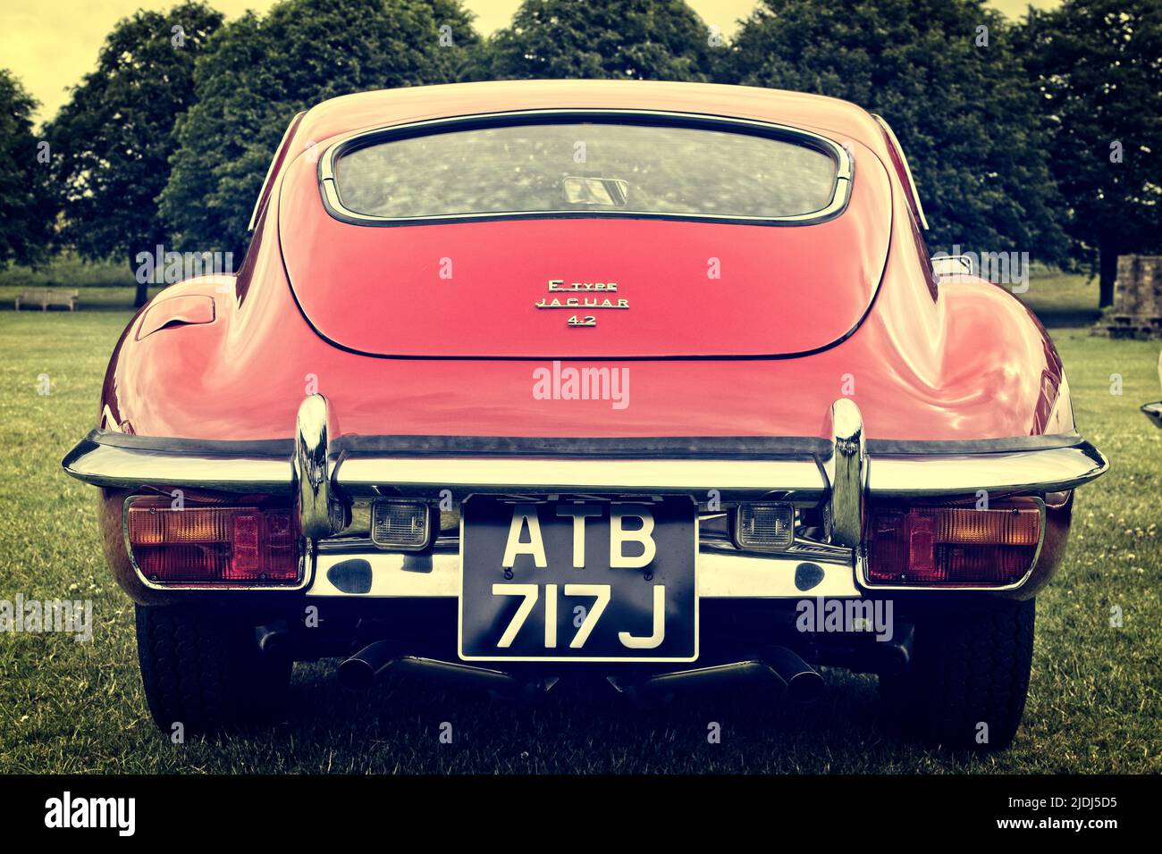 Rear end of a red classic vintage E-Type Jaguary motor car from 1970. Stock Photo