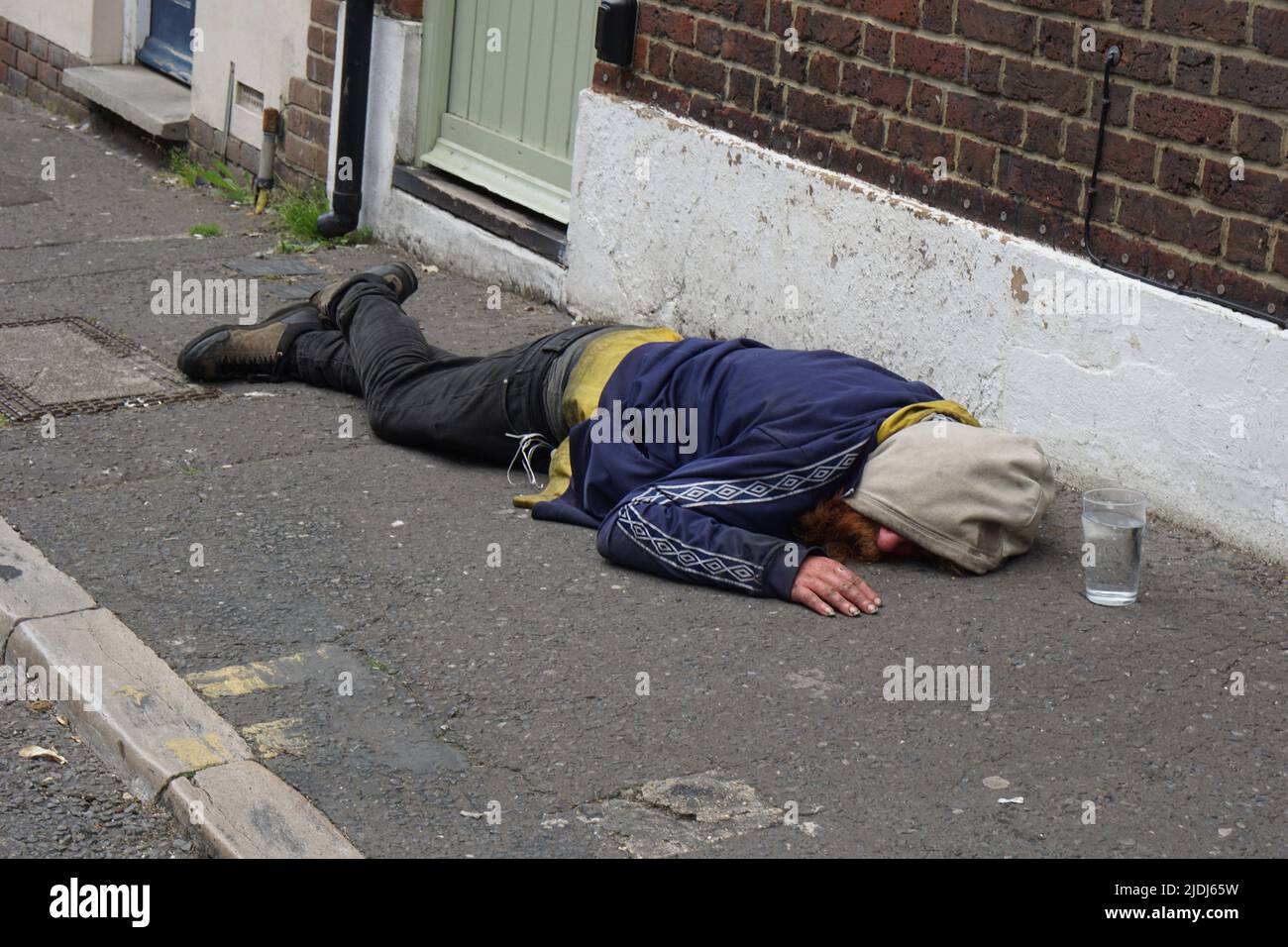 Homeless Drunk Passed Out, Brighton Stock Photo