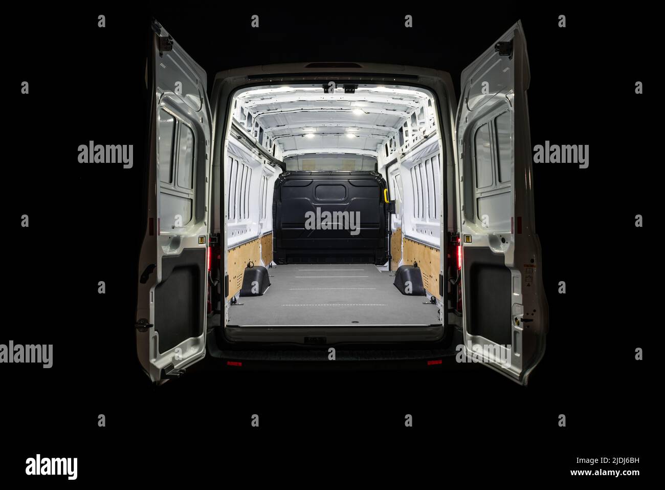 Empty van with open doors an light inside Stock Photo - Alamy