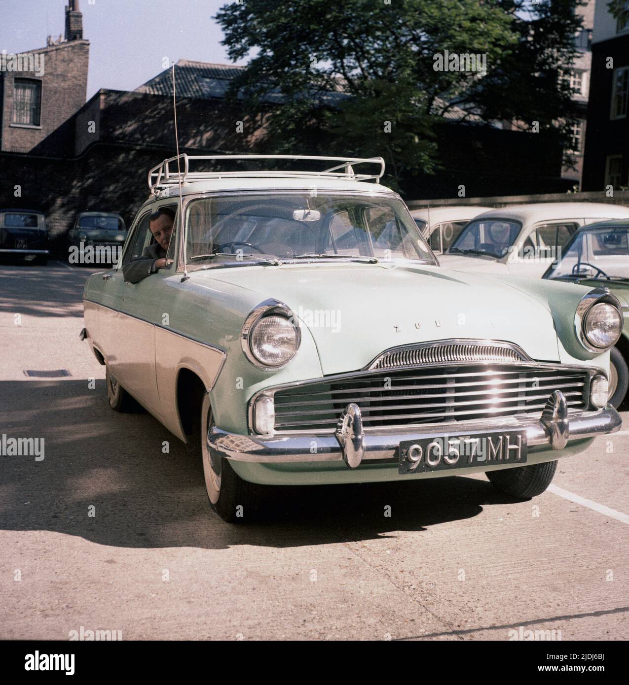 1964, historical, a gentleman sitting in a car of the era, a tone-tone, British Ford Zodiac, England, UK. Stock Photo