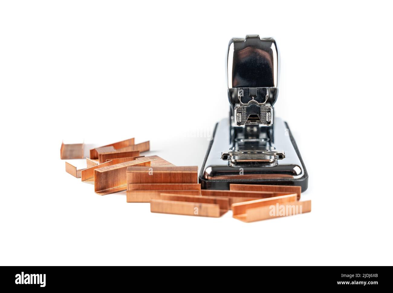 Silhouette of metal stapler with staples on isolated white background. Stock Photo