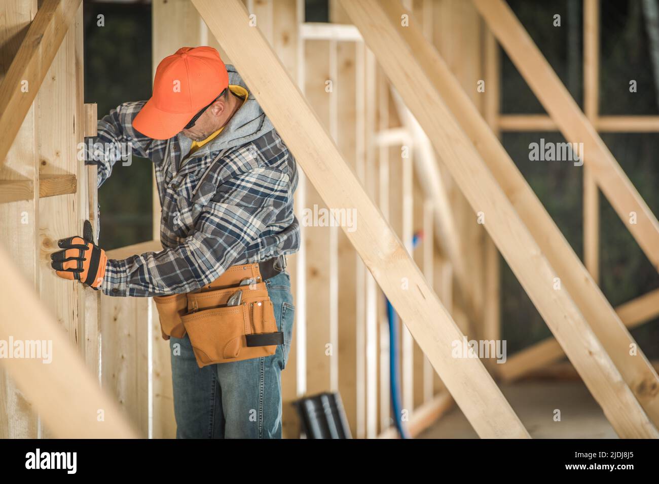 Constructing the Frame of the Wooden Building. Professional
