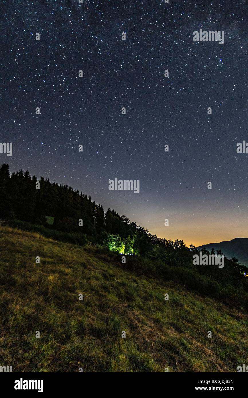 Mountain landscape with starry sky and milky way Stock Photo - Alamy
