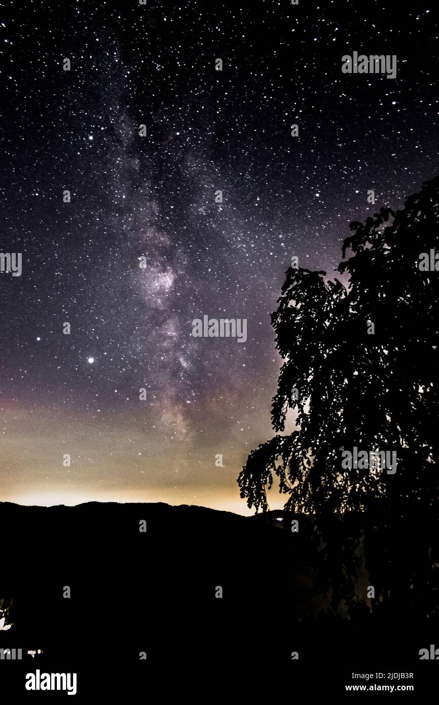 Mountain landscape with starry sky and milky way Stock Photo - Alamy
