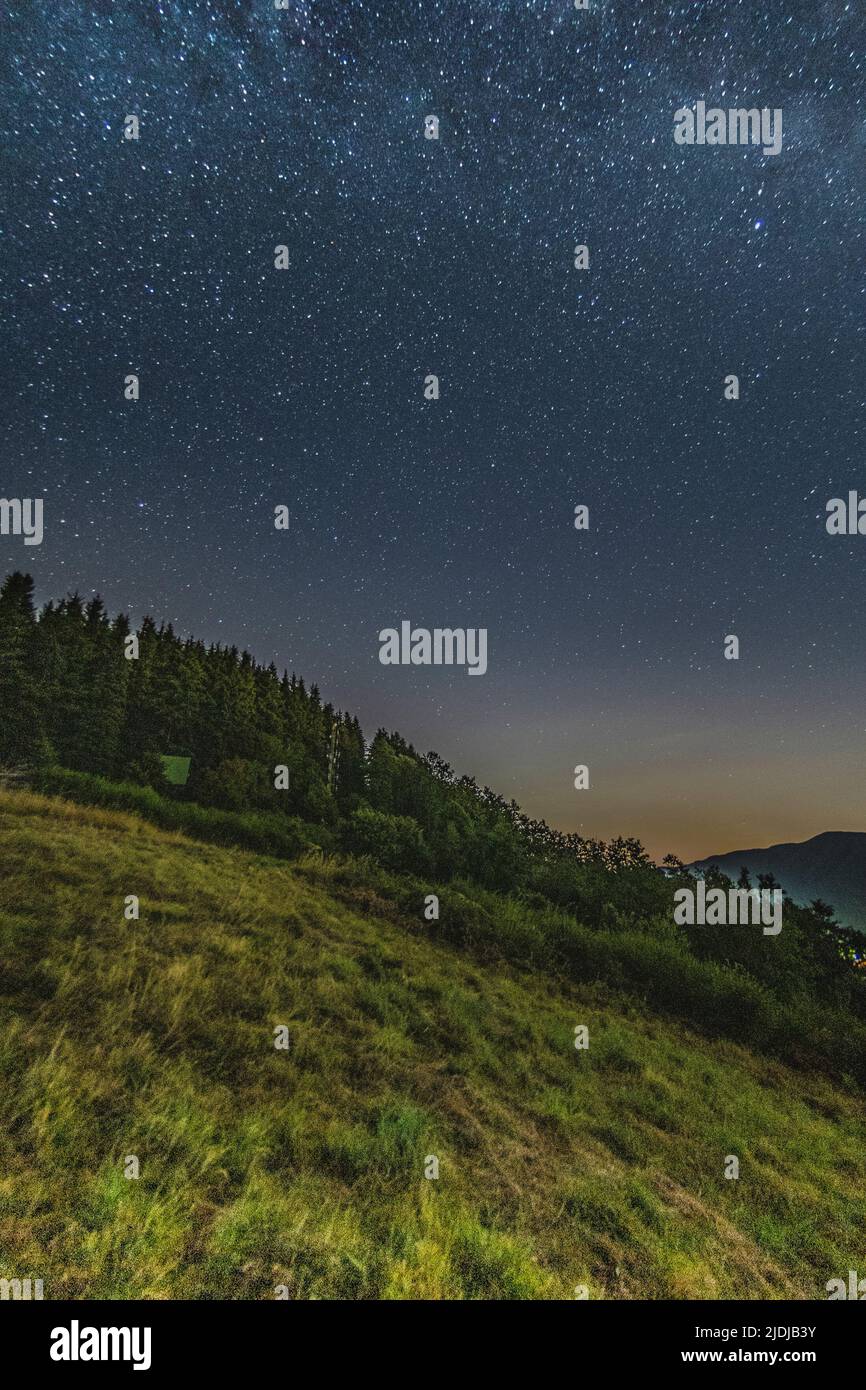 Mountain landscape with starry sky and milky way Stock Photo - Alamy