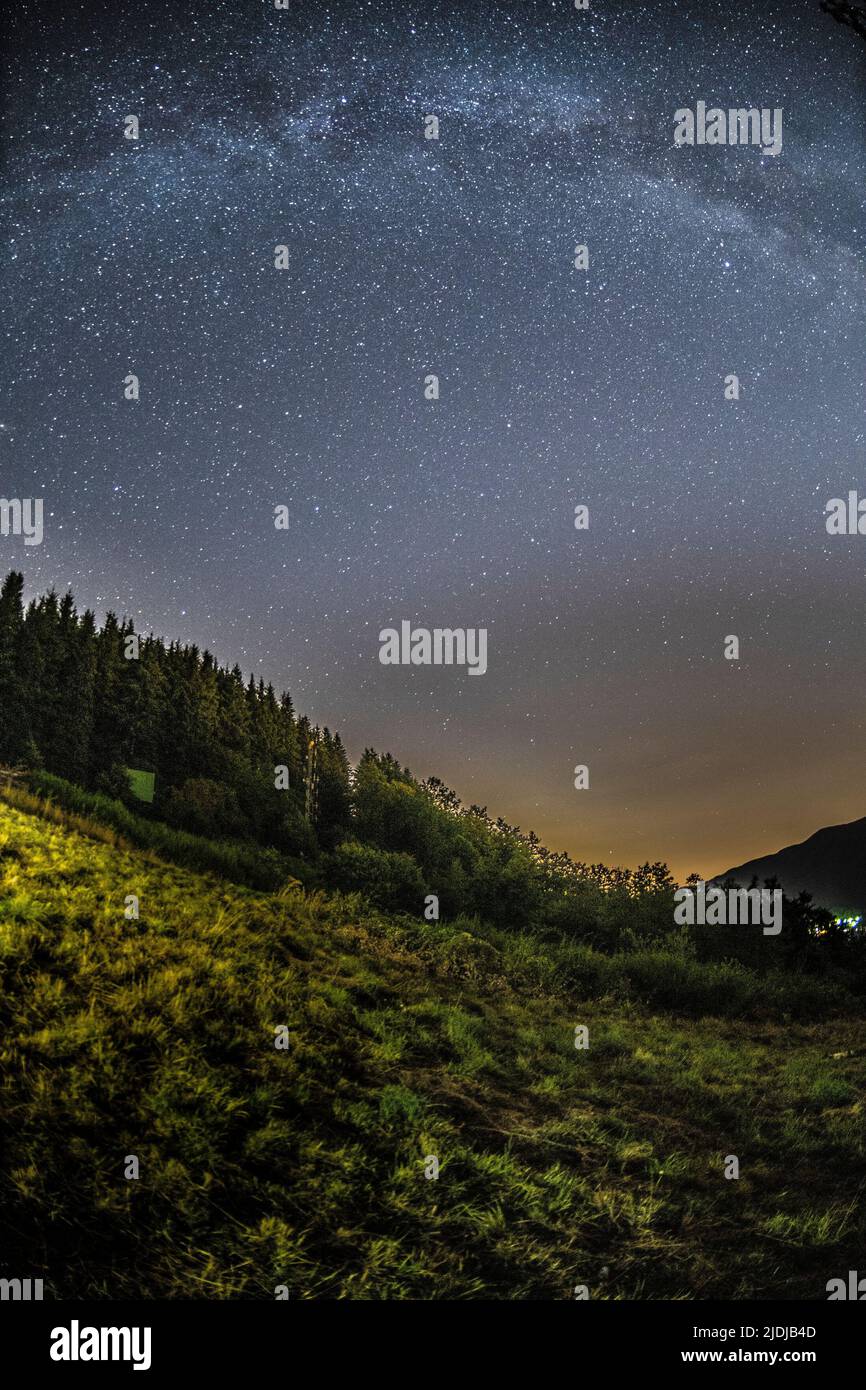 Mountain landscape with starry sky and milky way Stock Photo - Alamy