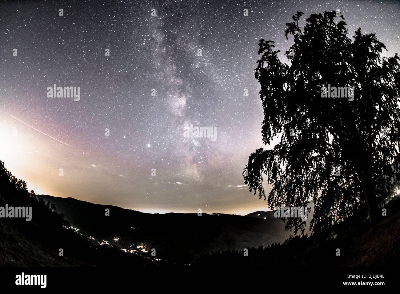 Mountain landscape with starry sky and milky way Stock Photo - Alamy