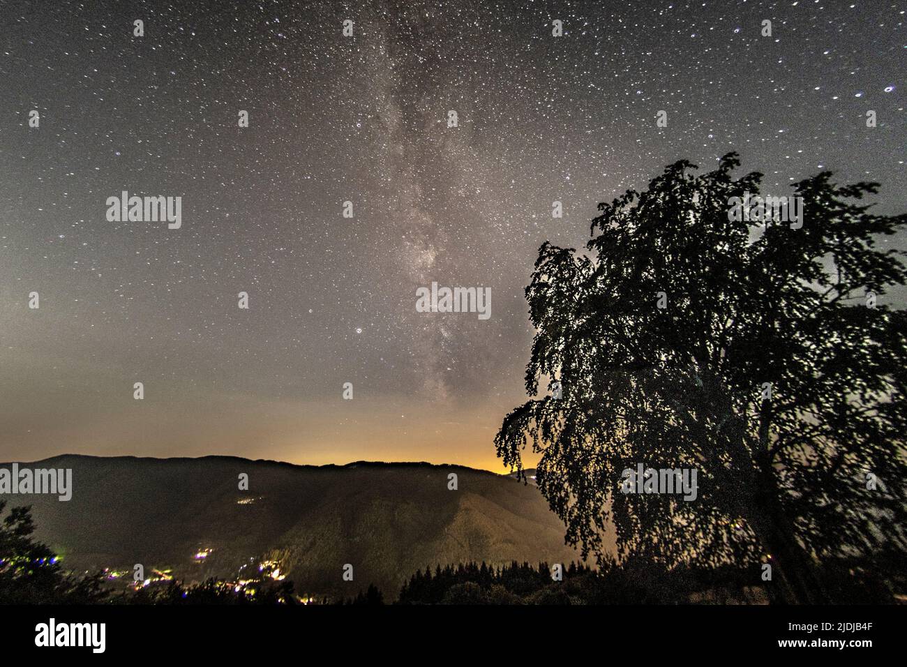 Mountain landscape with starry sky and milky way Stock Photo - Alamy