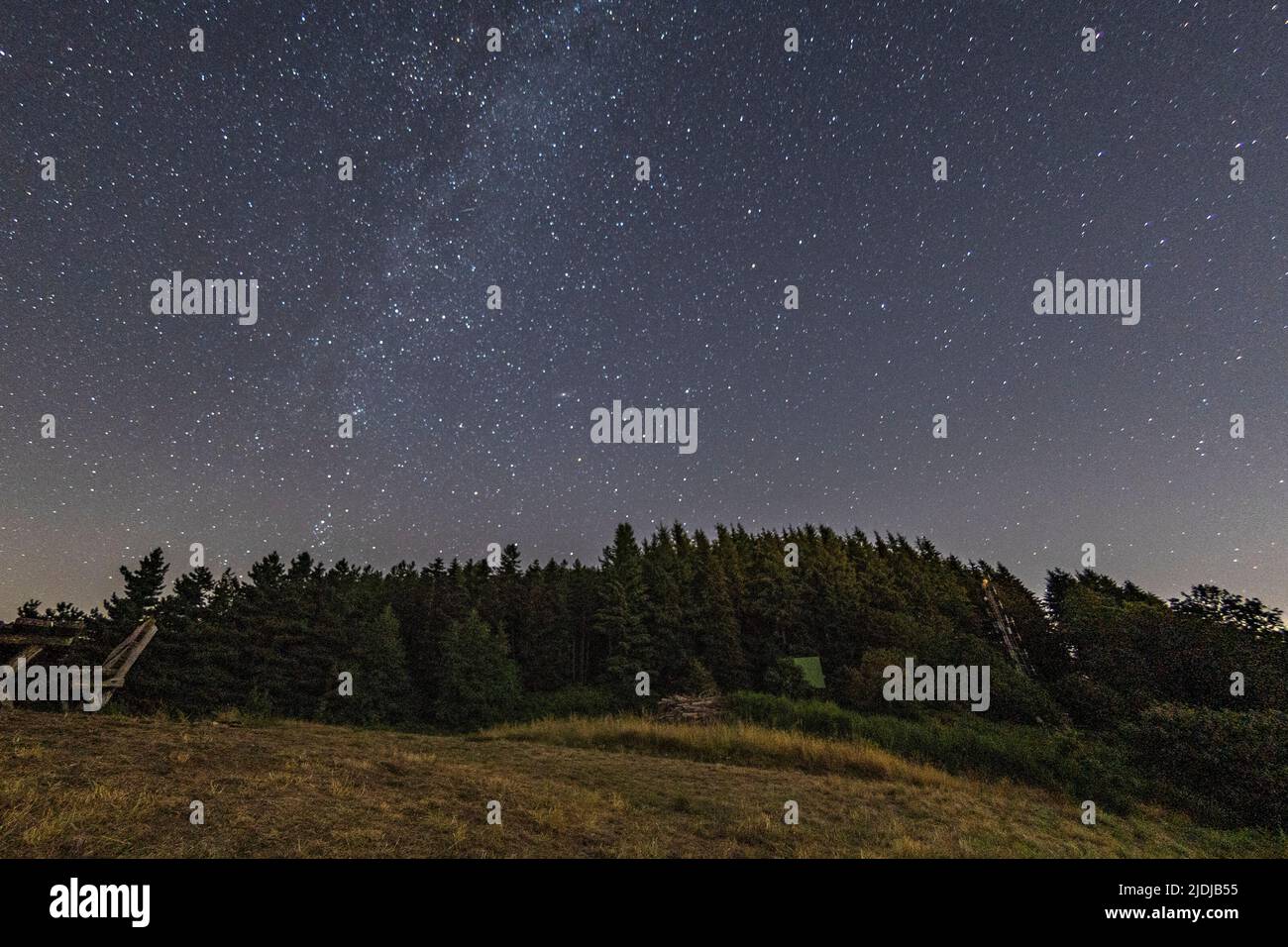Mountain landscape with starry sky and milky way Stock Photo - Alamy