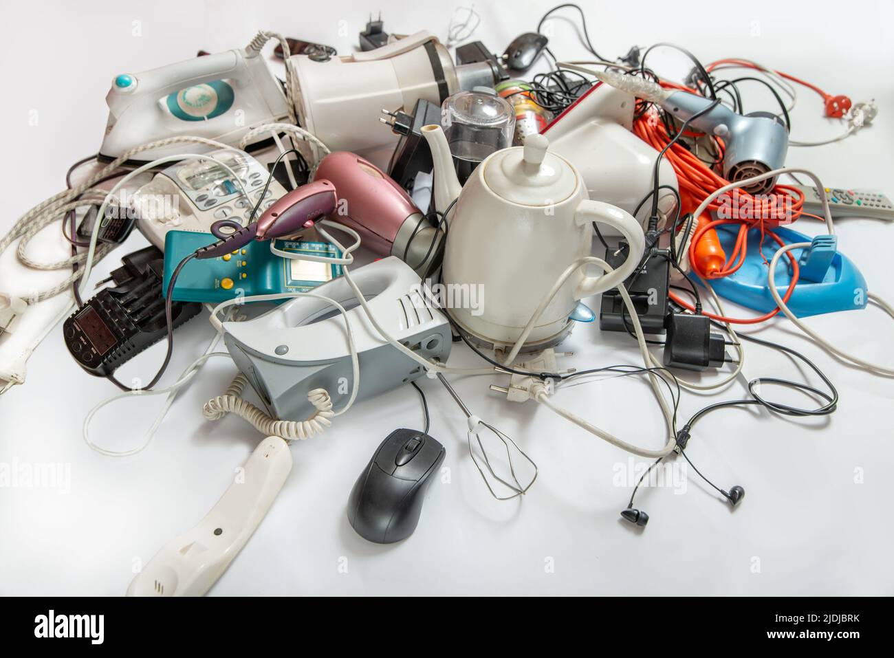 Lots of old electrical appliances for recycling e-waste. Sustainable living concept. Stock Photo