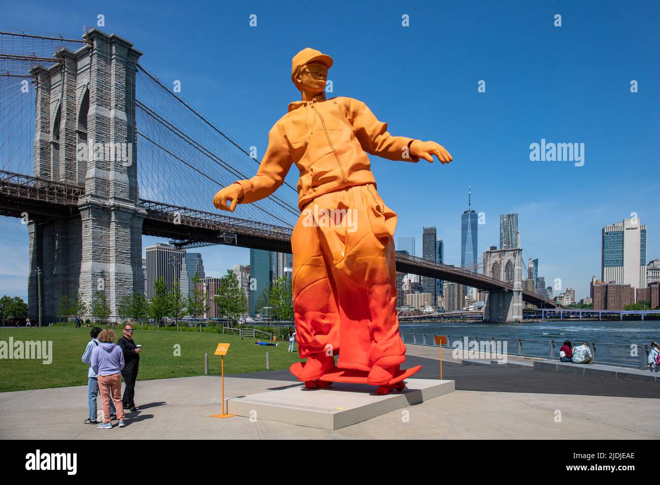Giant orange skateboarder sculpture celebrating Louix Vuitton x Nike Air Force 1 designed by Virgil Abloh. Brooklyn Bridge Park, New York City, USA. Stock Photo
