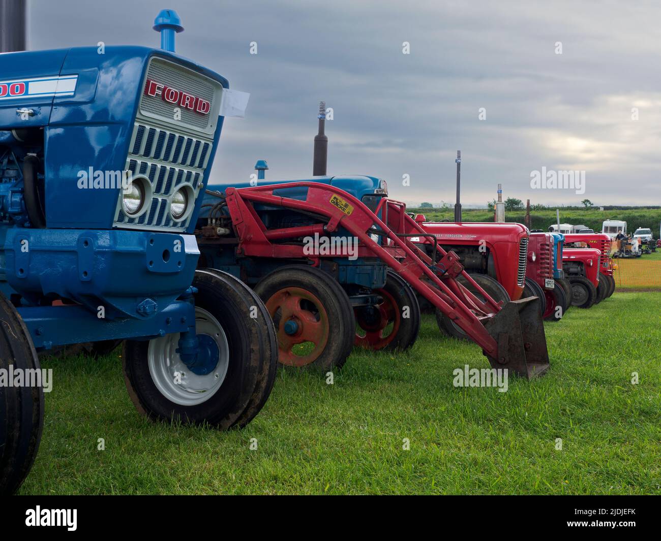 A row of vintage tractors at the Launceston Steam & Vintage Rally, Cornwall, UK Stock Photo