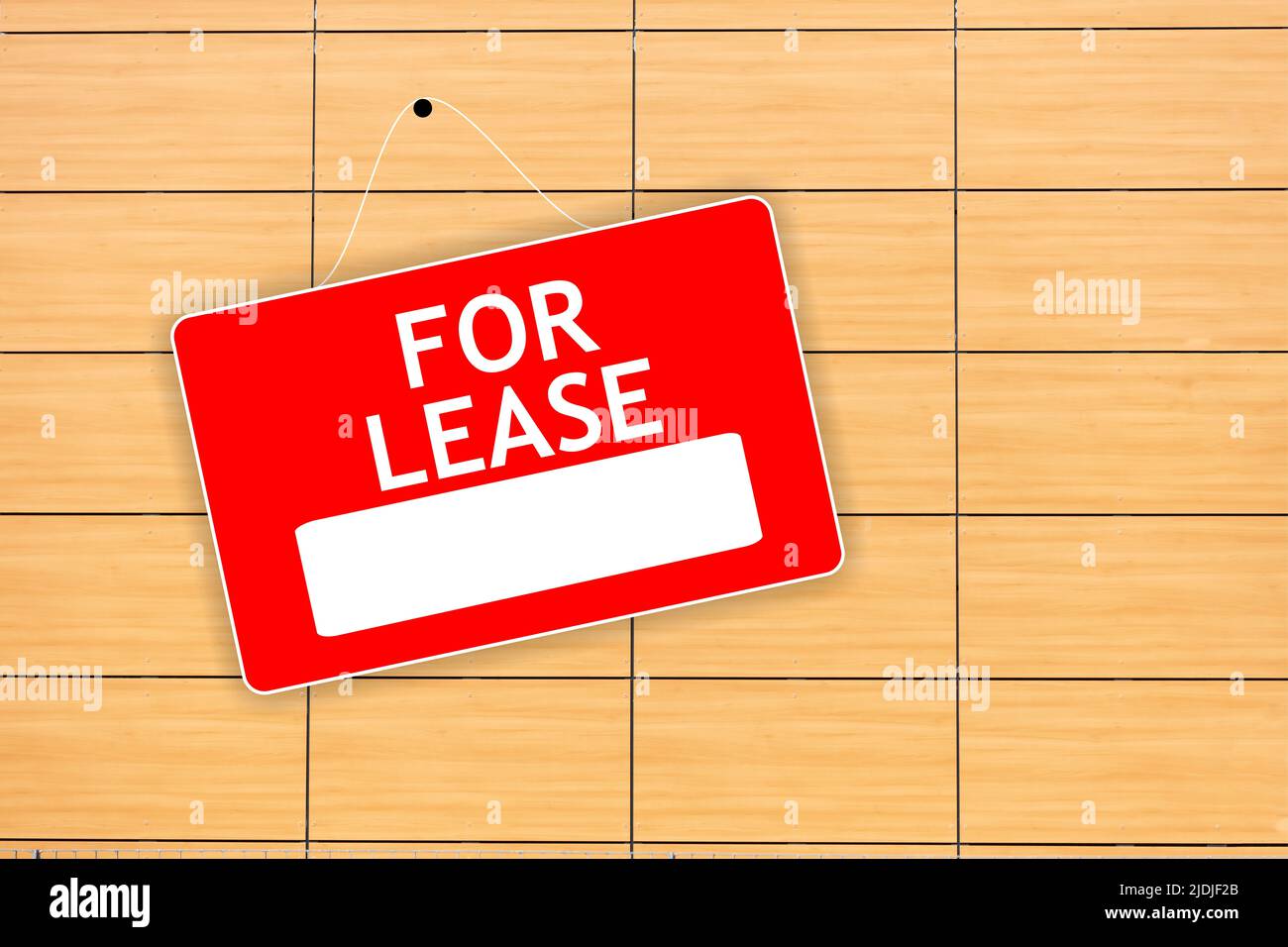 FOR LEASE red sign with white word and empty space for text on wooden background, advertising template. Label for real estate hiring hanged on wood de Stock Photo