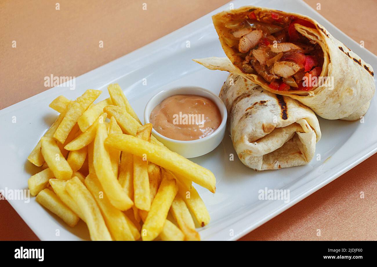 Chicken Wrap with sause and fried potatoes Stock Photo