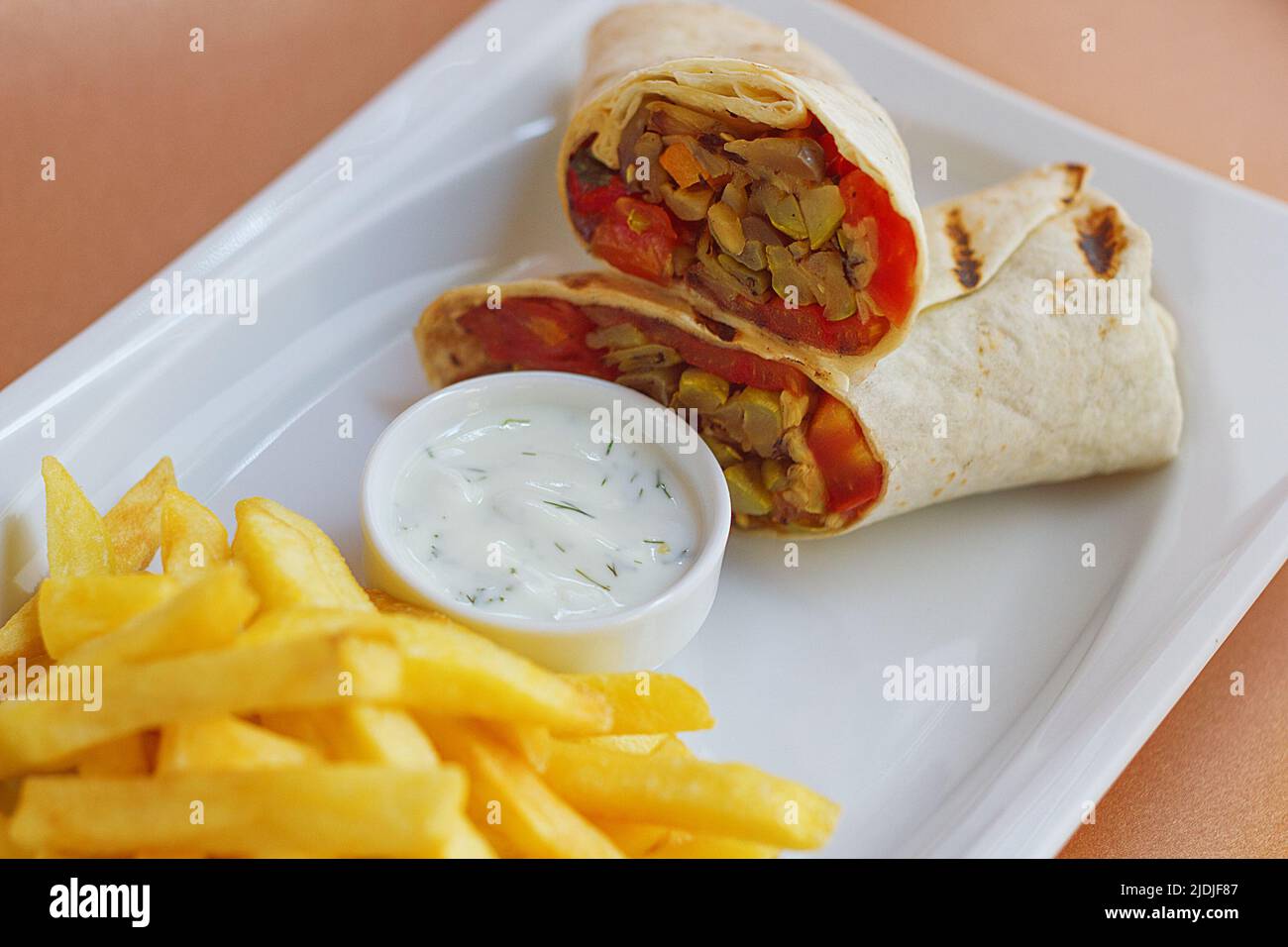 Meat Wrap with sause and fried potatoes Stock Photo