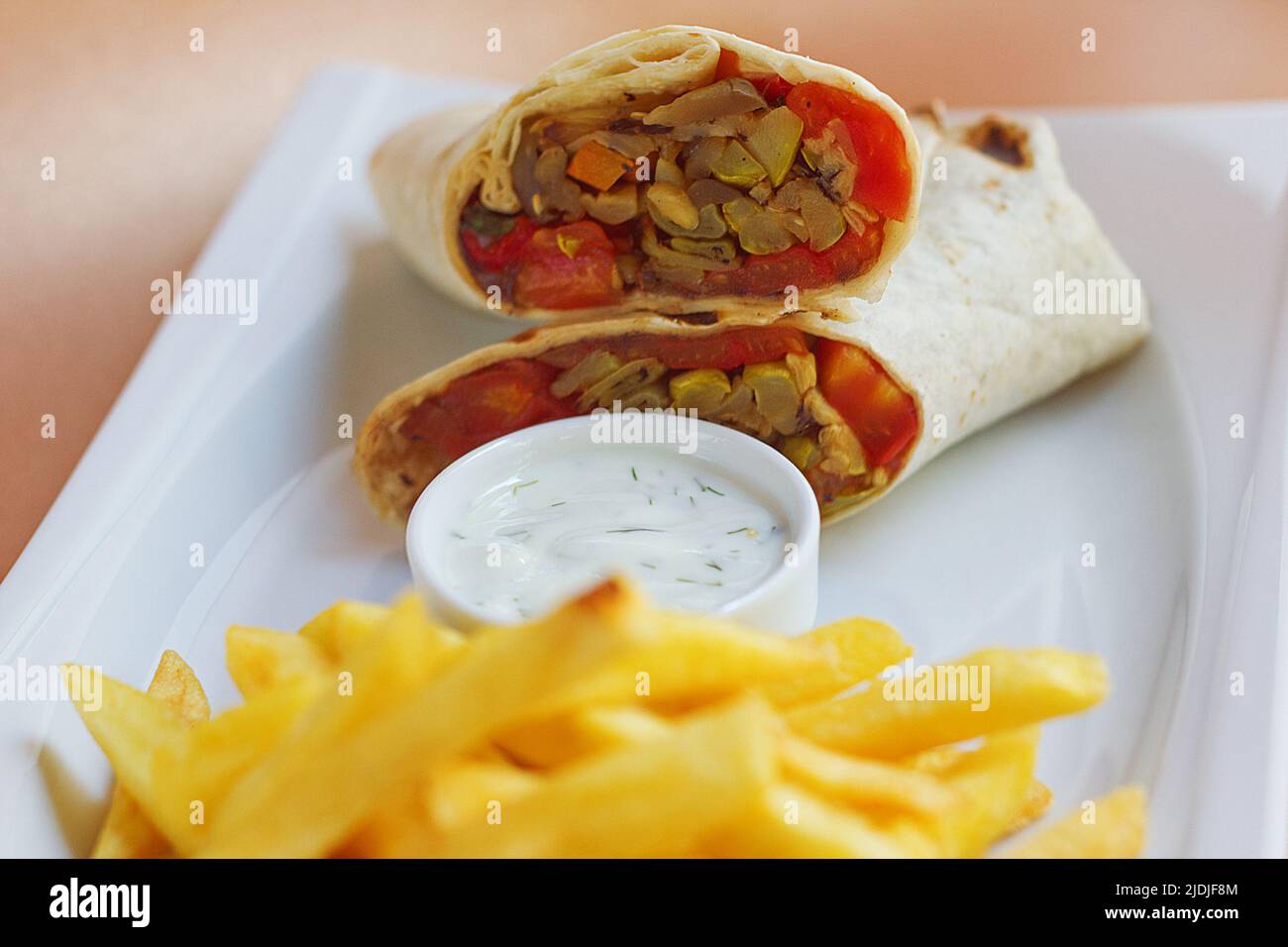 Meat Wrap with sause and fried potatoes Stock Photo