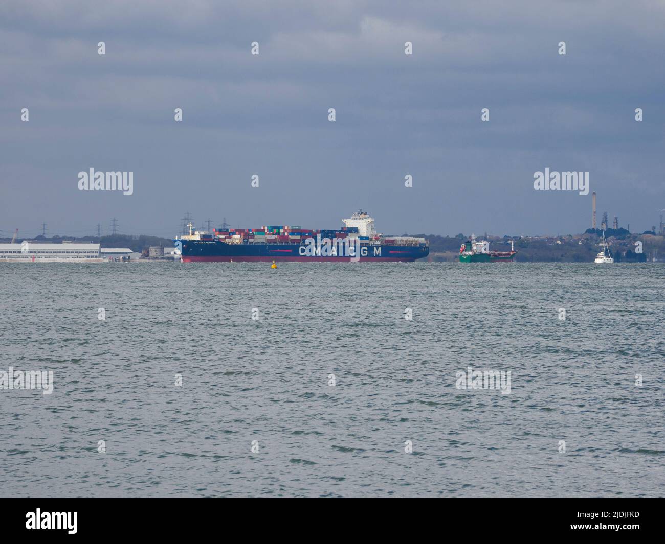 Container ship on the Southampton to East Cowes shipping lane, Hampshire UK Stock Photo