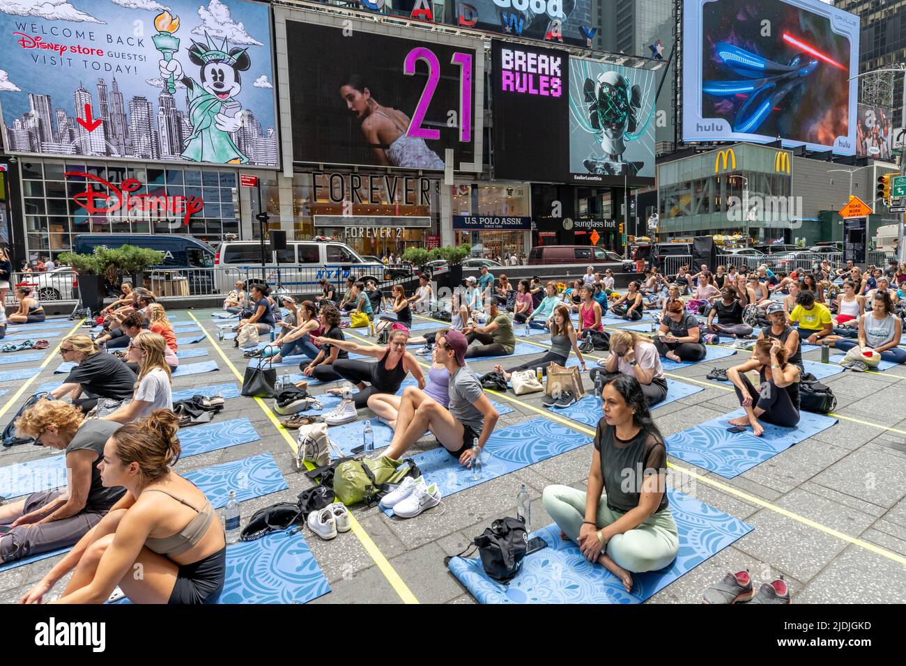 New York, USA. 21st June, 2022. People participate in a free yoga class in New York City's Times Square to celebrate the seventh International Yoga Day. Credit: Enrique Shore/Alamy Live News Stock Photo