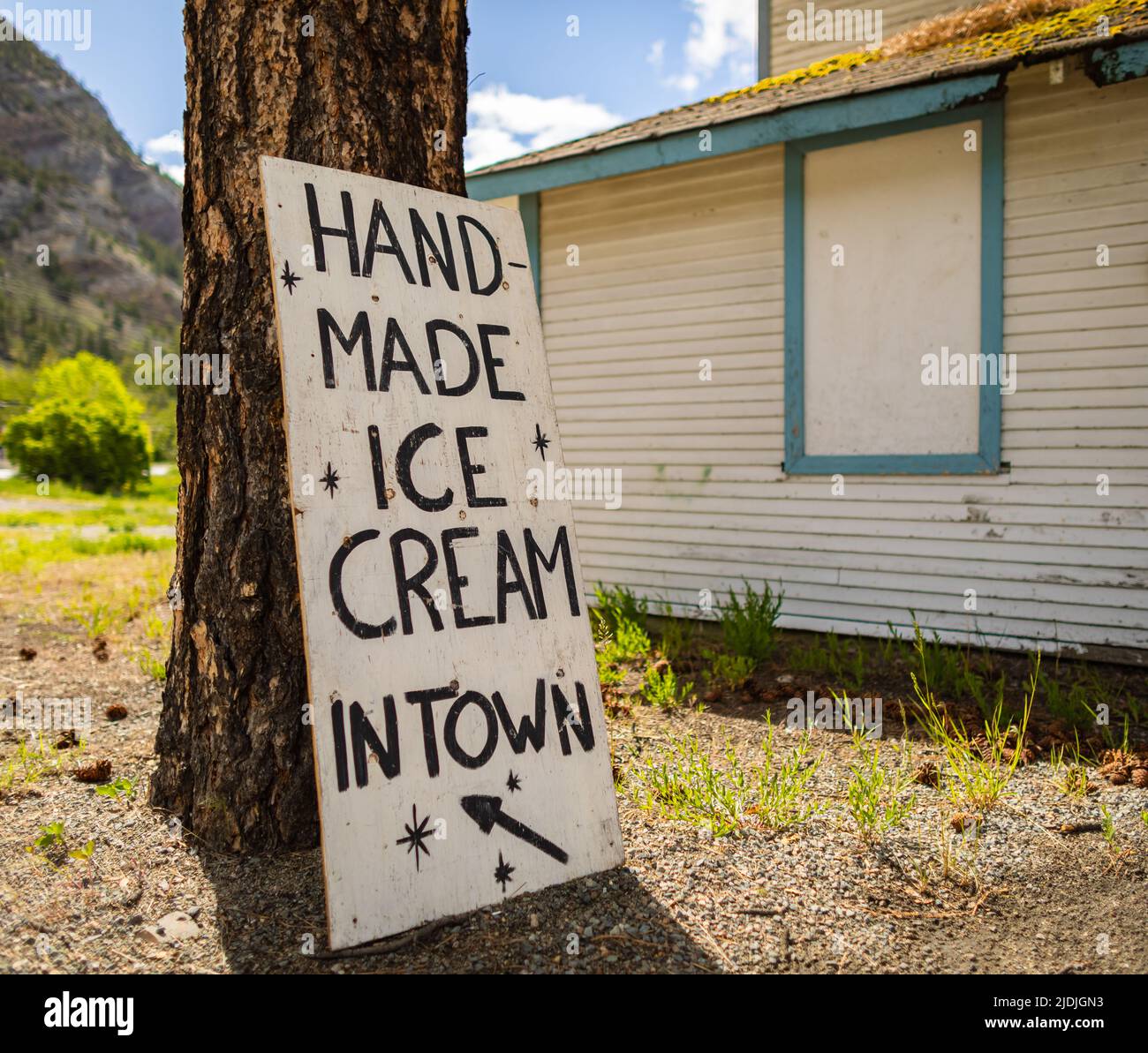 Hand drawn home made ice-cream sign board on a street of a rural small town in Canada. Stock Photo