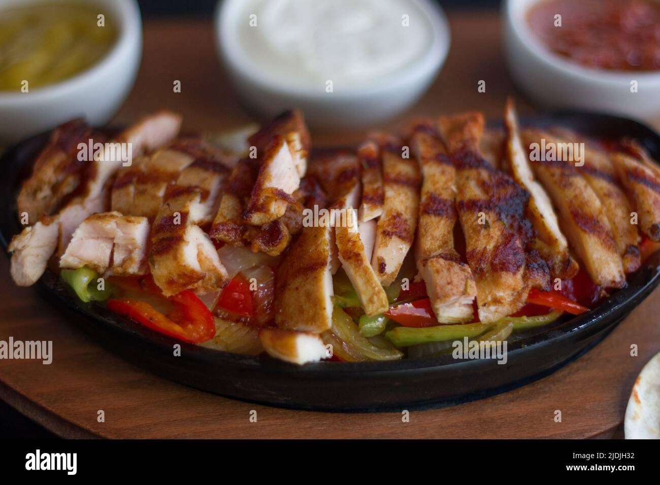 Chicken Fajita With Sauces On Pan Stock Photo Alamy
