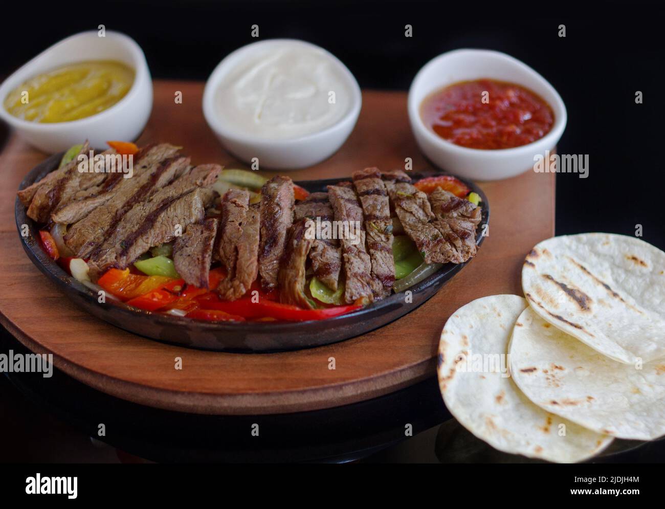 Beef Fajita With Sauces On Pan Stock Photo Alamy