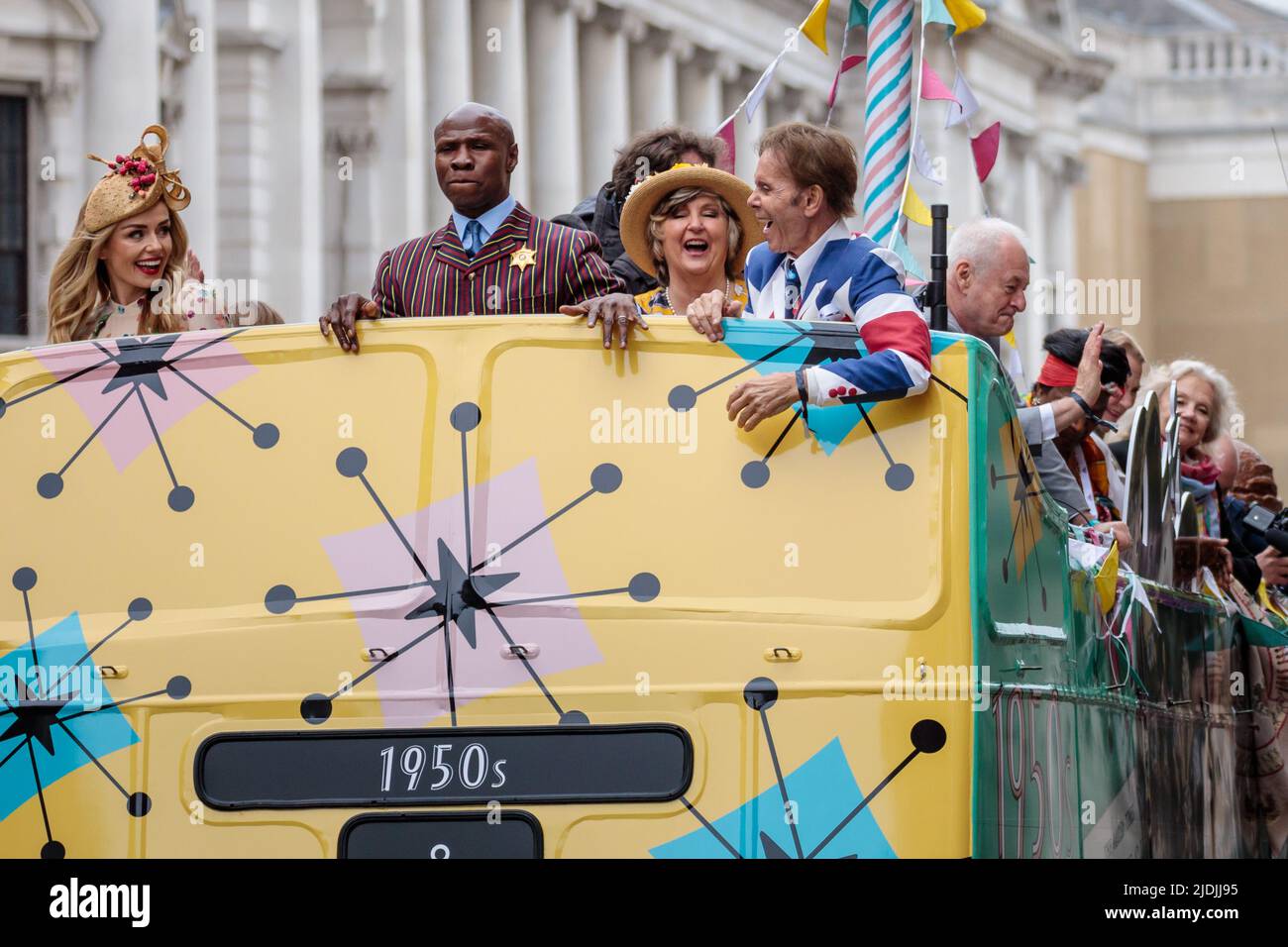 'National Treasures' on board the 1950s bus, one of 7 for each decade of Her Majesty's reign, at the The Platinum Jubilee Pageant as it proceeds along Stock Photo