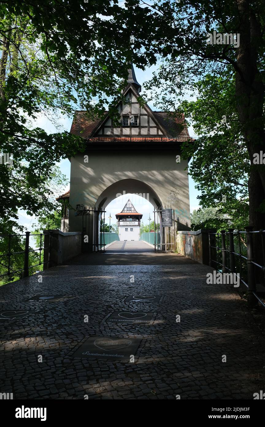 Berlin, Germany, June 14, 2022, view through the archway of the shore-side stoop house to the island-side bridge house on the Isle of Youth. Stock Photo