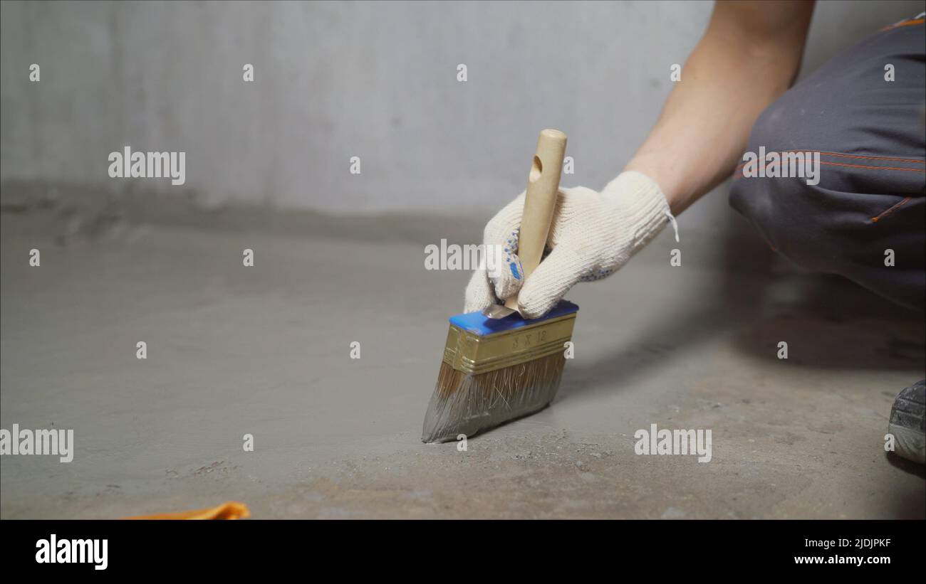 Waterproofing concrete mortar. The master puts waterproofing on a