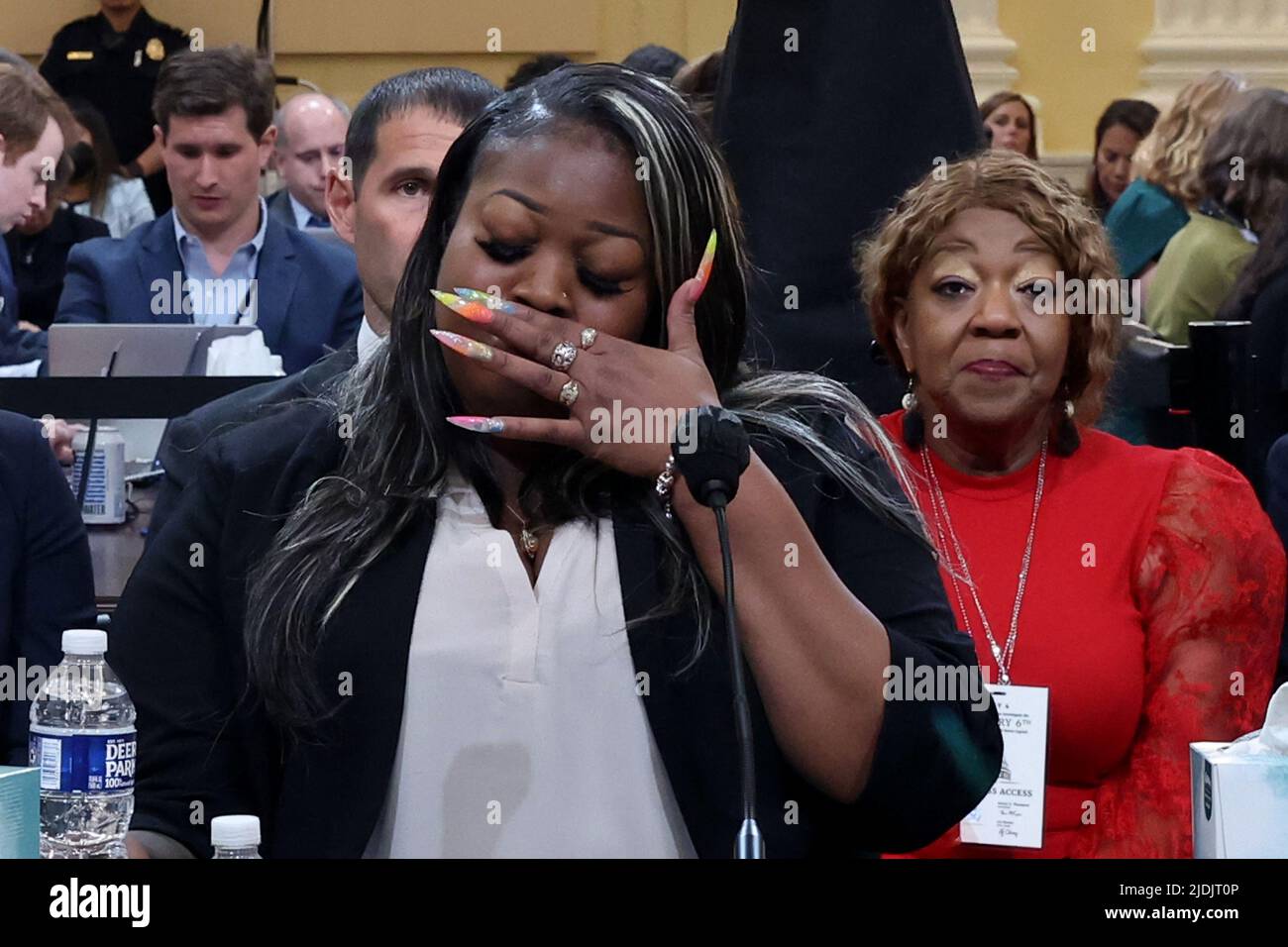 Washington, United States. 21st June, 2022. Former Georgia election worker Wandrea ArShaye Moss wipes her eyes as she testifies as the House select committee investigating the Jan. 6 attack on the U.S. Capitol holds a public hearing to discuss its findings of a year-long investigation, on Capitol Hill in Washington, DC on Tuesday, June 21, 2022. Pool photo by Michael Reynolds/UPI Credit: UPI/Alamy Live News Stock Photo