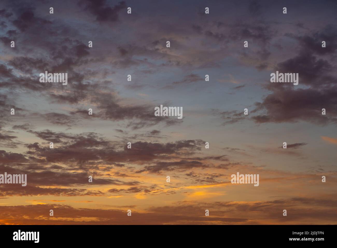 Dramatic sunset sky, cloudscape with colorful twilight clouds Stock Photo