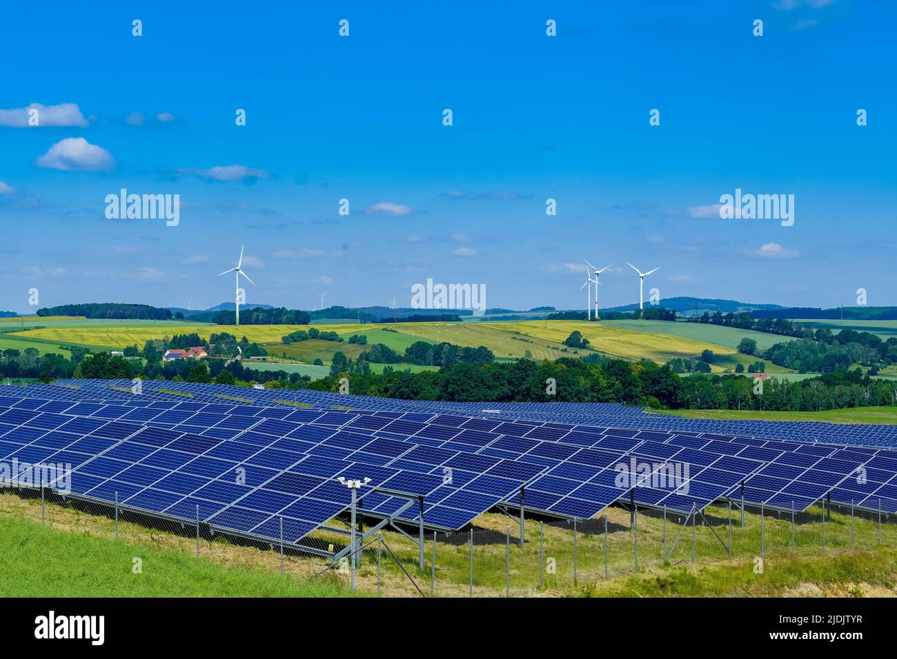 Wind turbines and solar power plant during sunny day Stock Photo - Alamy
