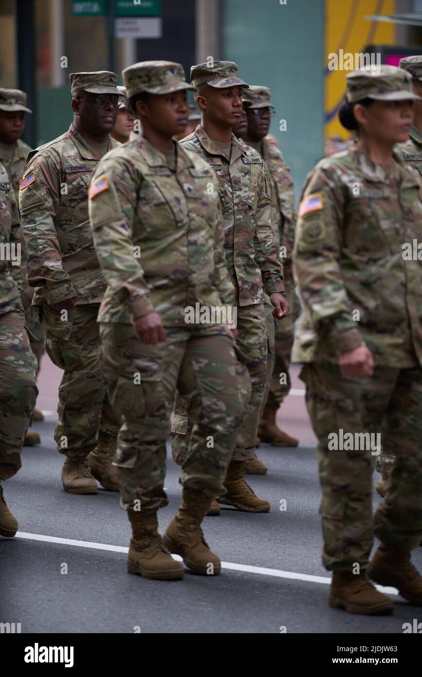 Manhattan, New York,USA - November 11. 2019: 77th U.S. Army Soldiers marching on Fifth Avenue in NYC. US Military Infantry waring camouflage uniforms. Stock Photo